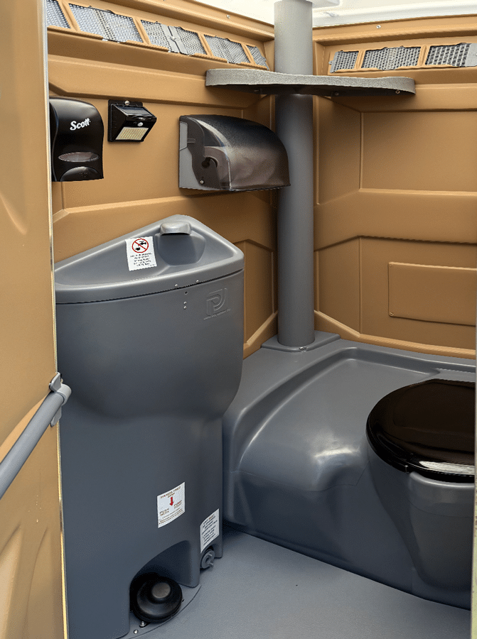 Our Wedding toilets come equipped a few more amenities than a standard toilet, like a Hand Wash sink, soap, and paper towel dispensers, and an auto light.